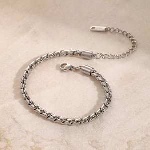 Detail of silver 316L stainless steel flat chain bracelet with lobster clasp and tag