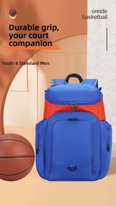 Deep blue basketball backpack with orange accents featuring spacious compartments for gear