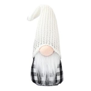Christmas gnome doll with white knitted hat and black white checkered body on white background