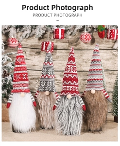 Detail of four Christmas gnomes with striped arms and various faux fur beards on wood decor