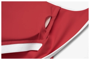 Detail of red yoga bodysuit showing inner bra pad pockets and white contrast piping