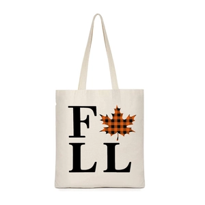 Detailed close-up of a canvas tote bag featuring an autumn-themed FALL print and maple leaf
