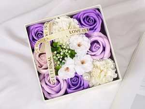 Square gift box with purple roses and white carnations featuring Love is Eternal ribbon