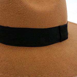 Brown wool fedora hat featuring a black grosgrain ribbon band and British jazz style