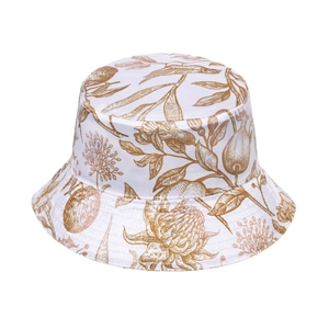 Detail of white bucket hat featuring gold vintage floral and bird patterns in toile style