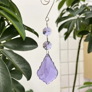 Macro detail of purple crystal maple leaf suncatcher with faceted glass beads and S-hook