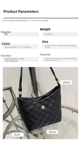 Close-up of black PU quilted shoulder bag featuring gold floral logo and stitch detail