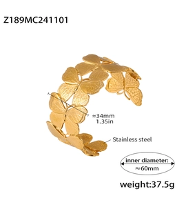 Detail view of gold butterfly cuff bracelet with size specs and stainless steel texture