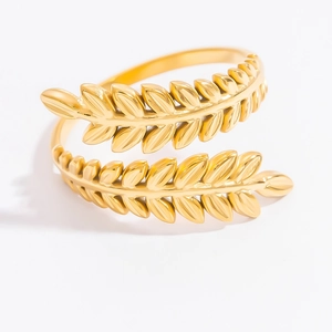 Close-up of golden double-layer leaf design on adjustable stainless steel ring
