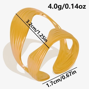 Macro detail of gold S-shaped open ring showing 3.2cm width and 1.7cm opening size