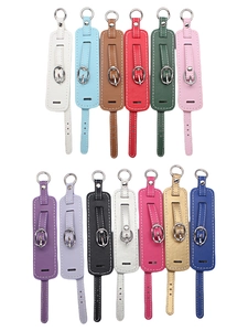 Detail view of 13 colors PU leather wristbands with gold metal buckles and D-ring attachments
