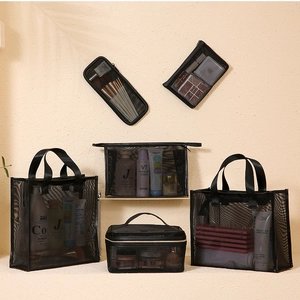 Detail view of 6-piece black mesh cosmetic storage bag set for travel organization
