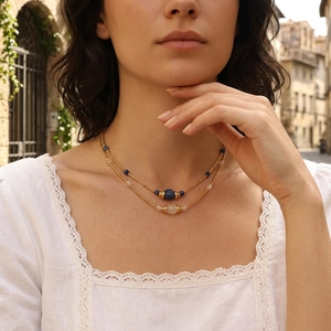 Lapis lazuli and amazonite beaded necklace shown in lifestyle shot on a model wearing lace