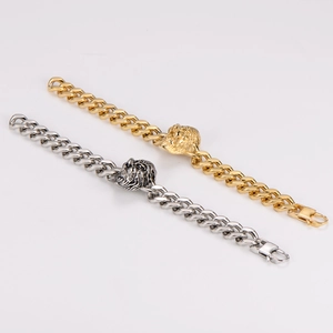 Mens stainless steel Cuban link bracelet with lion head detail in gold and silver finish