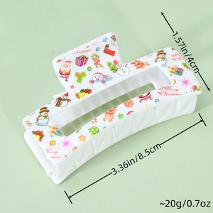 Detailed view of Christmas claw clip measuring 3.36 inches with Santa and reindeer prints