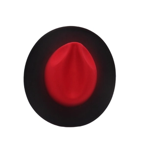 Overhead view of a dual-color wool felt fedora with a vibrant red top and black wide brim