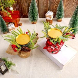 Christmas candle holder with pine needles red berries and pinecones for table decor