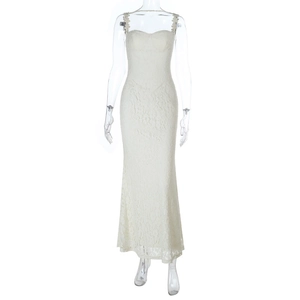 Detailed view of delicate white floral lace fabric on a slim fit long slip dress