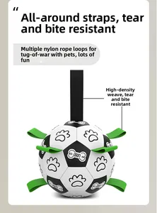Detail of dog soccer ball toy featuring nylon grab tabs and durable woven straps for tugging