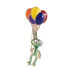 Detailed close-up of a green enamel frog brooch being lifted by colorful balloons