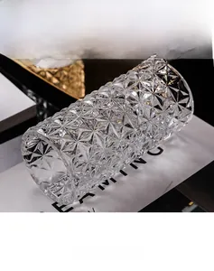 Macro detail of luxury glass candle holder with elegant geometric diamond-cut textures