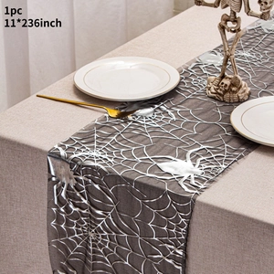 Detail of 11x236 inch silver spider web table runner for Halloween dining decor