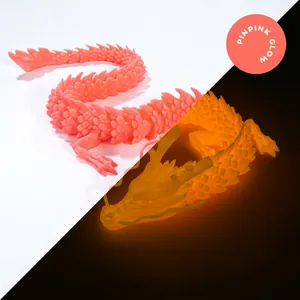 Detail of 3D printed articulated dragon with pink finish and glowing orange night light effect