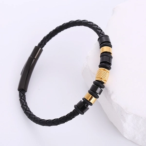 Men's woven leather bracelet in black with gold and black metal beads on stone