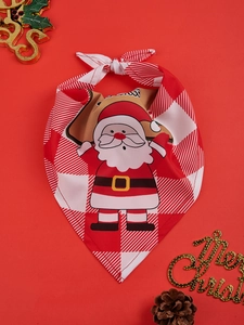 Close-up of red plaid Christmas pet bandana with Santa print on festive red background