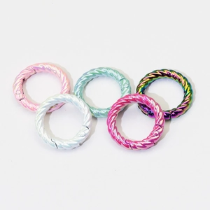 Colorful twisted metal spring rings in pink, green and white for DIY keychain jewelry