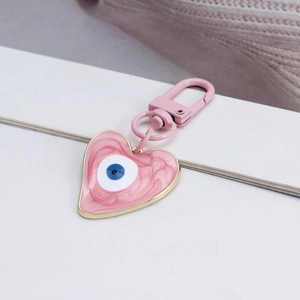 Pink heart-shaped Evil Eye keychain with golden alloy ring for car and bag charms