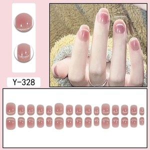 Short round pink cat-eye press-on nails with glitter gradient and blush effect