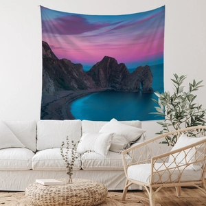 Detail of bohemian beach tapestry with sunset coastal view and digital printing texture