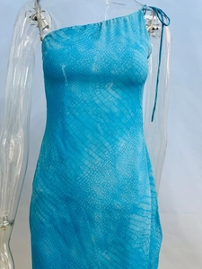 Detail of light blue one shoulder dress with textured snake print and tie strap