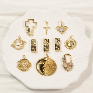 Gold-plated hip hop cross pendants with micro-pave zircons on a white shell tray