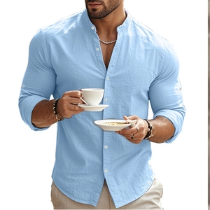 Detail of light blue slim fit cotton shirt with stand collar and buttoned sleeve