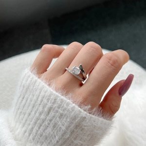 Close-up of S925 silver ring featuring an oval zircon and split shank with side stones