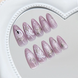 Cat eye purple press on nails with silver moon, bow and star in almond shape