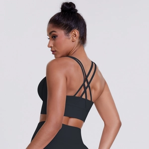 Detail of cross-back straps on black sports bra with high-elasticity brushed fabric