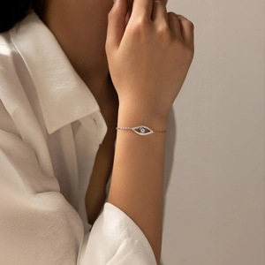 Elegant S925 sterling silver hollow eye bracelet with blue sapphire and pavé diamonds