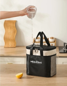Waterproof detail of insulated lunch bag showing water-resistant Oxford fabric with meal bag text