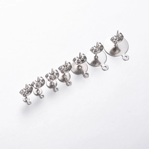 Flat round stainless steel stud earring bases with loops in various sizes on white background