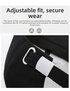 Close-up of the adjustable metal buckle and strap on the back of a black baseball cap