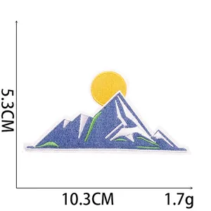 Detail showing embroidered mountain patch size 10.3cm x 5.3cm with sun and snow peak
