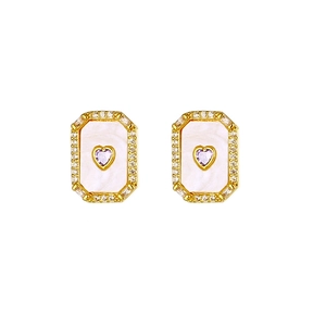 Close-up of gold earrings with mother-of-pearl inlay and purple heart zircon centers