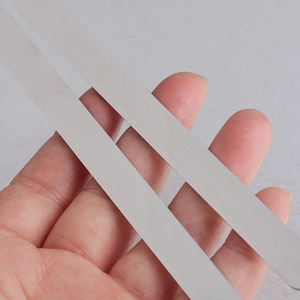 Detailed close-up of polished silver-colored stainless steel rectangular DIY cuff blanks