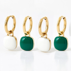 Modern gold-plated square enamel earrings in white and green on white background