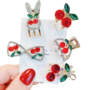Charming red cherry hair clip and jewelry set featuring crystals and cute rabbit ear designs