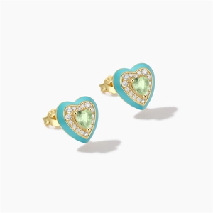 Detailed macro of S925 silver heart stud earrings with blue enamel and green gemstone