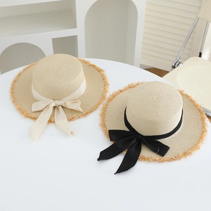 Flat top raffia straw hats with elegant bows and frayed edges for summer beach vacation